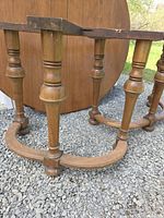 Two pedestal bases with turned legs and curved feet