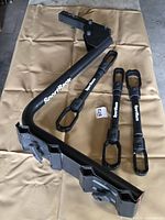Entire rack arm, hitch mount, three adapters visible