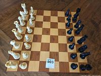 full chess set arranged on board