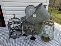 Group shot showing both galvanized tubs (one inside the other), bird cage, candle holder stand, and wire lantern