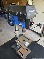 Full view of Mastercraft drill press on bench