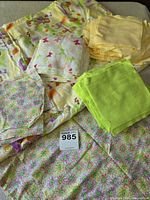 Full view of kit contents: several stacks of pre-cut flannel squares and folded backing fabric