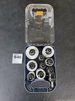 open case showing hole saws, arbors and label