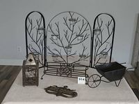 Front view of all five metal decor items in lot