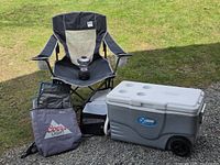 Group shot of all items: chair, lantern, hard cooler, soft cooler bag, tote