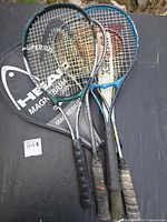 Overall view of four racquets and Head cover