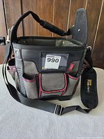 Front view of Stanley FatMax tool bag showing exterior pockets, shoulder strap, ID slot
