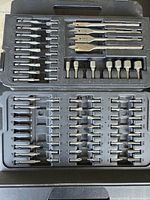 Driver bit tray showing spade bits, nut drivers and assorted driver bits