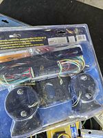 Packaged submersible light set showing wires and round lamp backs