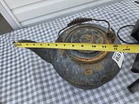 Top view of cast iron kettle showing measurement tape