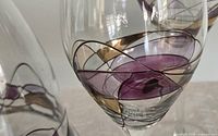 Close-up of mosaic swirl design on wine glass