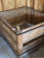 Overall view of wooden pallet crate in garage