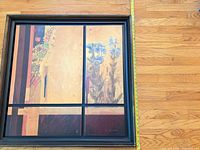 Full view of framed print with measuring tape showing width