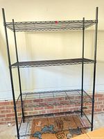 Full frontal view of assembled black wire shelving unit