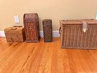 all four lidded baskets and trunks side by side