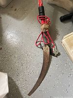 Curved saw blade, pruning hook, taped repair and red pull cord on Corona pole pruner