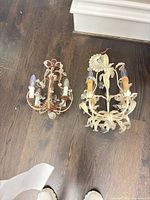 Both sconces side by side showing overall design and color difference