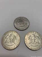 Three Kennedy half dollar reverse sides