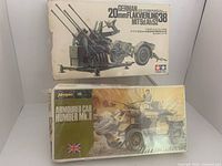 Front view of both boxed model kits showing titles and artwork