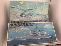 Front of both kit boxes showing titles and artwork