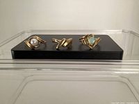 All three gold rings on display block