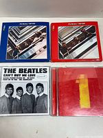 Front covers of all four Beatles CD releases