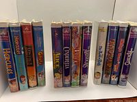 All 12 Disney VHS tapes standing in two groups