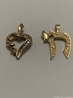 Both gold pendants side by side