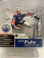 Front view of sealed McFarlane Grant Fuhr figure in package