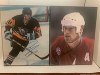 Both signed photographs side by side