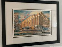 Full view of framed lithograph on wall