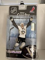 Front view of sealed Sidney Crosby NHL action figure in packaging