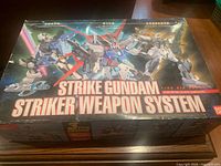 Front of boxed Bandai Strike Gundam Striker Weapon System model kit