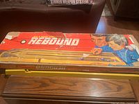 Worn red Rebound box top showing graphics