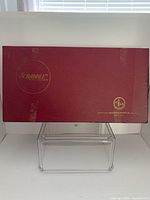 Front view of burgundy Scrabble box