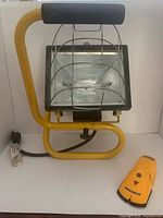 Work light and stud finder side by side showing overall condition