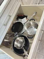 Drawer view showing all cookware pieces together