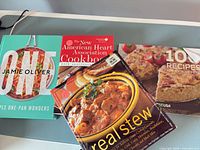 Group shot of all four cookbooks front covers visible