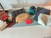 Group shot of all pouches and cases on table