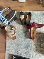 Overview of all four pairs on floor with Converse box