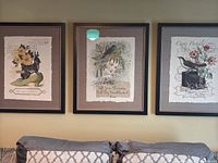 All three framed prints displayed on wall above sofa