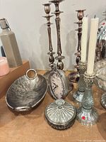 Group view showing candlesticks, bowl, clock, jar
