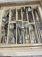 Drawer tray showing full assortment of stainless steel flatware pieces
