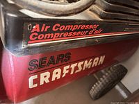 Close view of Craftsman red tank and branding