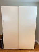 two white door panels standing upright