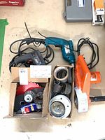 Overall lot with two drills, cutoff saw, accessory box