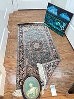 Runner rug, portrait print and ocean painting grouped together
