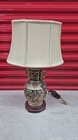 Full view of lamp with shade, showing design and base