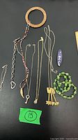 Full layout of all jewellery pieces on black background