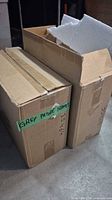 Two cardboard cartons labelled Grey Picture Frames, styrofoam visible